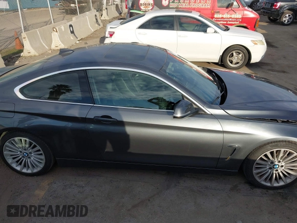 2014 BMW 4 Series 428i with VIN WBA3N7C5XEF719384, listed as a IAAI auction lot 41694678 with 115,517 mi miles and . Bid and sale history available at carsss.com. Image 13.