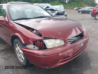 2000 Toyota Camry CE z VIN JT2BG22K3Y0521541, wystawiony jako IAAI lot #42074772 z przebiegiem 144 587 mil mil oraz . Historia ofert i sprzedaży dostępna na DreamBid. Obrazek 6.