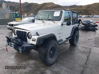 2001 Jeep Wrangler Sport with VIN 1J4FA49S41P308407, listed as a IAAI auction lot 41772240 with 139,461 mi miles. Bid and sale history available at carsss.com. Image 2.