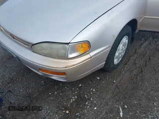 1996 Toyota Camry DX z VIN 4T1BG12K8TU754331, wystawiony jako IAAI lot #42305723 z przebiegiem 152 709 mil mil oraz . Historia ofert i sprzedaży dostępna na DreamBid. Obrazek 6.