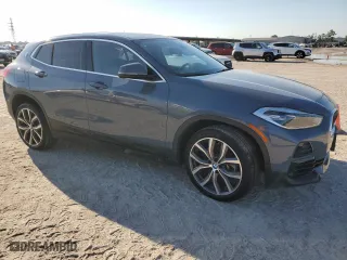 2021 BMW X2 xDrive28i with VIN WBXYJ1C04M5S07696, listed as a Copart auction lot 73412384 with 35,004 mi miles and Salvage Title. Bid and sale history available at carsss.com. Image 4.