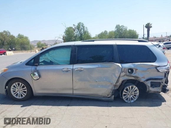 2015 Toyota Sienna XLE with VIN 5TDYK3DC0FS589947, listed as a IAAI auction lot 36567379 with 130,969 mi miles and . Bid and sale history available at DreamBid. Image 15.