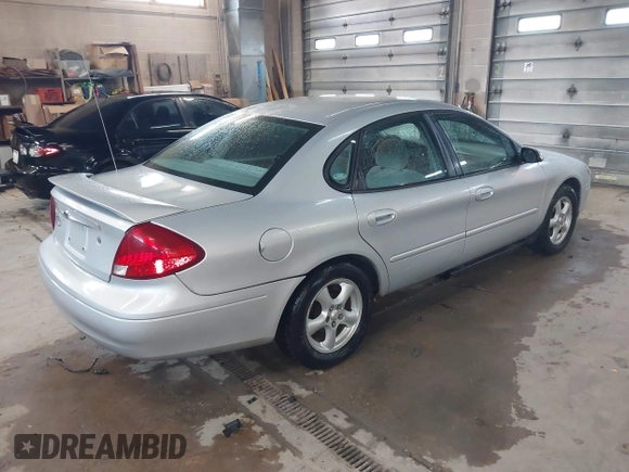 2003 Ford Taurus SES Standard with VIN 1FAFP55U13G222465, listed as a IAAI auction lot 42168336 with 128,078 mi miles. Bid and sale history available at carsss.com. Image 4.