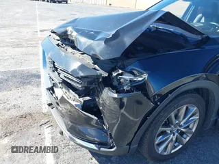 2018 Mazda CX-9 Grand Touring z VIN JM3TCADY8J0221221, wystawiony jako IAAI lot #41644721 z przebiegiem 41 510 mil mil oraz . Historia ofert i sprzedaży dostępna na DreamBid. Obrazek 6.