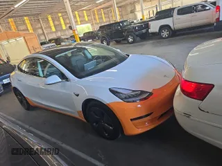 2020 Tesla Model 3 Long Range with VIN 5YJ3E1EB5LF790609, listed as a IAAI auction lot 42239989 with 14,853 mi miles and . Bid and sale history available at DreamBid. Image 5.