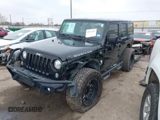 2017 Jeep Wrangler Unlimited Rubicon Recon z VIN 1C4HJWFG9HL592824, wystawiony jako IAAI lot #41427433 z przebiegiem 70 105 mil mil oraz . Historia ofert i sprzedaży dostępna na DreamBid. Obrazek 6.