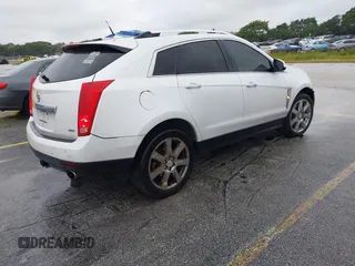 2012 Cadillac SRX Performance Collection with VIN 3GYFNEE33CS528697, listed as a IAAI auction lot 41374060 with 157,319 mi miles and . Bid and sale history available at DreamBid. Image 4.