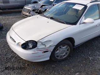 1999 Ford Taurus SE Standard with VIN 1FAFP58U5XG200924, listed as a IAAI auction lot 41501093 with 105,102 mi miles and . Bid and sale history available at DreamBid. Image 6.