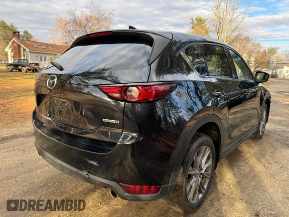 2020 Mazda CX-5 Grand Touring with VIN JM3KFADM8L0785373, listed as a Copart auction lot 50829175 with 135,736 mi miles and Clean Title. Bid and sale history available at DreamBid. Image 4.