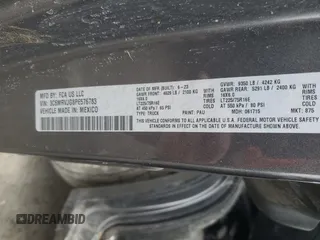 2023 Ram ProMaster Cargo with VIN 3C6MRVJG8PE576783, listed as a Copart auction lot 47352655 with 47,162 mi miles and Salvage Title. Bid and sale history available at DreamBid. Image 12.