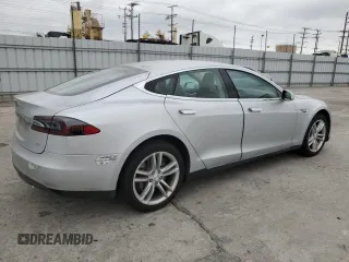 2014 Tesla Model S 60 with VIN 5YJSA1H14EFP34335, listed as a Copart auction lot 65504325 with Not provided miles and Clean title. Bid and sale history available at DreamBid. Image 3.