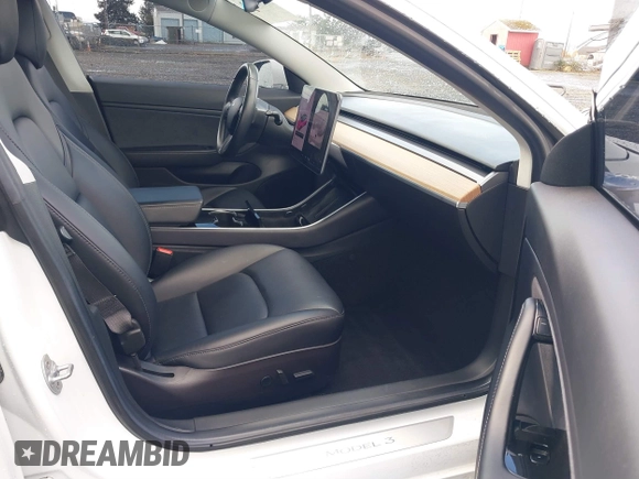 2018 Tesla Model 3 Long Range Battery with VIN 5YJ3E1EA3JF013253, listed as a IAAI auction lot 41752102 with 84,459 mi miles. Bid and sale history available at carsss.com. Image 5.