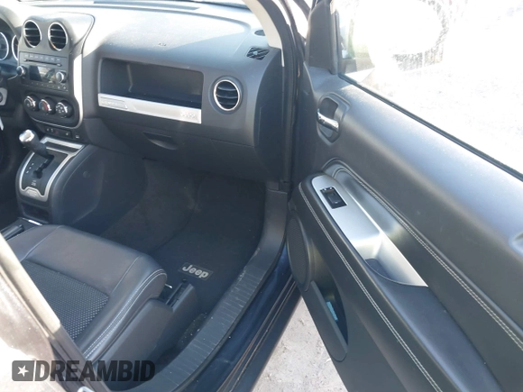 2014 Jeep Compass Latitude with VIN 1C4NJCEB3ED560058, listed as a IAAI auction lot 41470125 with 116,319 mi miles. Bid and sale history available at carsss.com. Image 5.
