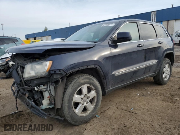 2013 Jeep Grand Cherokee Laredo with VIN 1C4RJEAG1DC584166, listed as a Copart auction lot 52785975 with 210,961 mi miles and Clean Title. Bid and sale history available at carsss.com. Image 1.