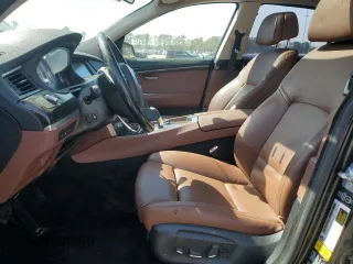 2014 BMW 5 Series GT 550i xDrive with VIN WBA5M0C5XED084908, listed as a Copart auction lot 50619945 with 97,680 mi miles and Salvage Title. Bid and sale history available at carsss.com. Image 7.