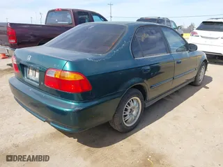 1999 Honda Civic VP with VIN 2HGEJ6619XH509582, listed as a IAAI auction lot 41774443 with 231,357 mi miles. Bid and sale history available at carsss.com. Image 4.