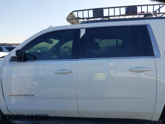 2019 Chevrolet Suburban LT with VIN 1GNSCHKC3KR143942, listed as a IAAI auction lot 41896633 with 153,139 mi miles and . Bid and sale history available at DreamBid. Image 14.