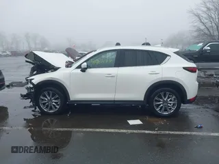 2020 Mazda CX-5 Grand Touring with VIN JM3KFBDMXL0785865, listed as a IAAI auction lot 41567177 with 64,519 mi miles. Bid and sale history available at carsss.com. Image 14.