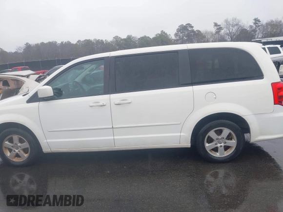 2012 Dodge Grand Caravan SXT with VIN 2C4RDGCG4CR304472, listed as a IAAI auction lot 41396437 with 180,309 mi miles and . Bid and sale history available at DreamBid. Image 14.