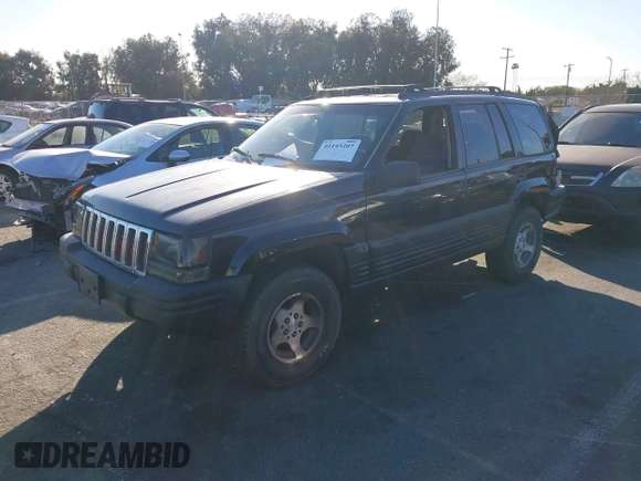 1998 Jeep Grand Cherokee Laredo with VIN 1J4FX58S8WC121904, listed as a IAAI auction lot 41145207 with 222,134 mi miles. Bid and sale history available at carsss.com. Image 2.