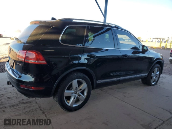 2011 Volkswagen Touareg с VIN WVGFG9BP2BD003056, выставлен на аукционе Copart как лот 84203674 с пробегом 171 456 миль миль и Списание • Salvage title. История ставок и продаж доступна на DreamBid. Изображение 3.