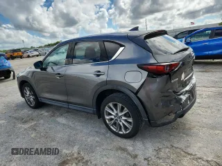 2019 Mazda CX-5 Grand Touring with VIN JM3KFADM2K1637664, listed as a Copart auction lot 63400975 with 45,663 mi miles and Salvage title. Bid and sale history available at DreamBid. Image 2.