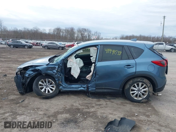 2016 Mazda CX-5 Touring with VIN JM3KE4CY8G0858045, listed as a IAAI auction lot 41941537 with 103,532 mi miles. Bid and sale history available at carsss.com. Image 14.