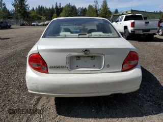 2000 Nissan Maxima GXE z VIN JN1CA31D0YT743476, wystawiony jako Copart lot #70160544 z przebiegiem 225 499 mil mil oraz Szkoda całkowita • Salvage title. Historia ofert i sprzedaży dostępna na DreamBid. Obrazek 6.