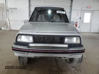 1990 Geo Tracker z VIN 2CNBJ18UXL6218795, wystawiony jako Copart lot #53083615 z przebiegiem 83 413 mil mil oraz Szkody całkowita. Historia ofert i sprzedaży dostępna na DreamBid. Obrazek 5.