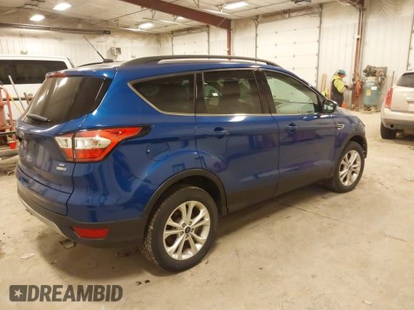 2018 Ford Escape SE with VIN 1FMCU9GD4JUA83470, listed as a IAAI auction lot 41272882 with 105,661 mi miles. Bid and sale history available at carsss.com. Image 4.