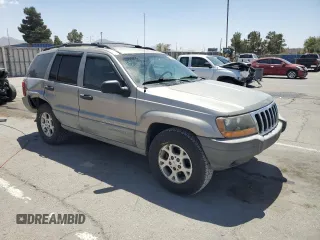 1999 Jeep Grand Cherokee Laredo with VIN 1J4GW58S1XC775877, listed as a Copart auction lot 55639795 with 197,611 mi miles and Salvage title. Bid and sale history available at DreamBid. Image 4.