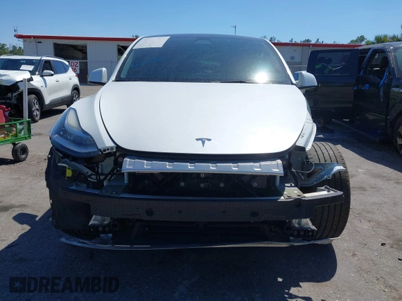 2022 Tesla Model Y Long Range with VIN 7SAYGAEE8NF431786, listed as a IAAI auction lot 41750353 with 67,846 mi miles and . Bid and sale history available at carsss.com. Image 13.