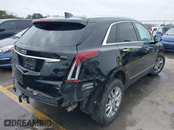 2021 Cadillac XT5 FWD Premium Luxury with VIN 1GYKNCRS3MZ103893, listed as a IAAI auction lot 41286761 with 75,728 mi miles and . Bid and sale history available at carsss.com. Image 4.