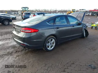 2018 Ford Fusion SE z VIN 3FA6P0HD7JR259606, wystawiony jako IAAI lot #41649797 z przebiegiem 94 094 mil mil oraz . Historia ofert i sprzedaży dostępna na DreamBid. Obrazek 4.