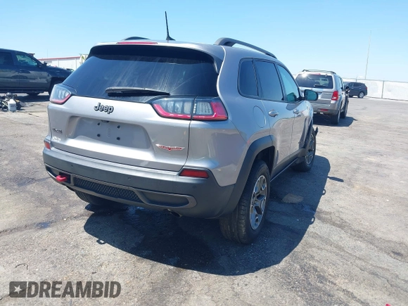 2020 Jeep Cherokee Trailhawk z VIN 1C4PJMBX1LD590087, wystawiony jako IAAI lot #42027620 z przebiegiem 91 033 mil mil oraz . Historia ofert i sprzedaży dostępna na DreamBid. Obrazek 4.