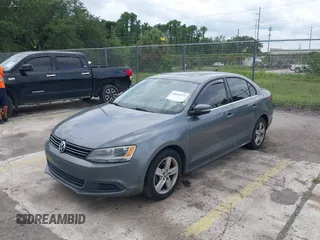 2013 Volkswagen Jetta TDI w/Premium with VIN 3VWLL7AJ4DM351806, listed as a IAAI auction lot 42654515 with 146,910 mi miles and . Bid and sale history available at DreamBid. Image 2.