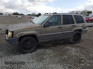 1995 Jeep Grand Cherokee Laredo z VIN 1J4FX58S9SC613836, wystawiony jako Copart lot #51786155 z przebiegiem 226 863 mil mil oraz Nie do naprawy • Non repairable. Historia ofert i sprzedaży dostępna na DreamBid. Obrazek 1.
