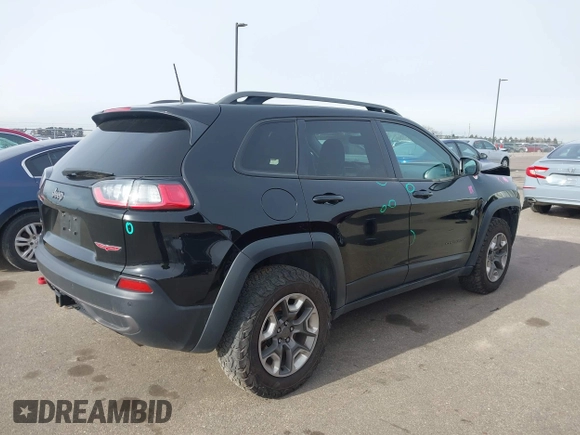 2019 Jeep Cherokee Trailhawk Elite with VIN 1C4PJMBX0KD395421, listed as a IAAI auction lot 41265048 with 70,070 mi miles. Bid and sale history available at carsss.com. Image 4.