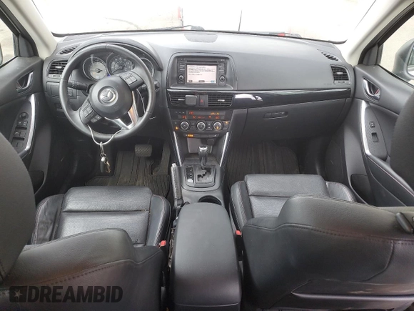 2014 Mazda CX-5 Grand Touring with VIN JM3KE4DY2E0354795, listed as a Copart auction lot 70713544 with 58,848 mi miles and Salvage Title. Bid and sale history available at DreamBid. Image 8.