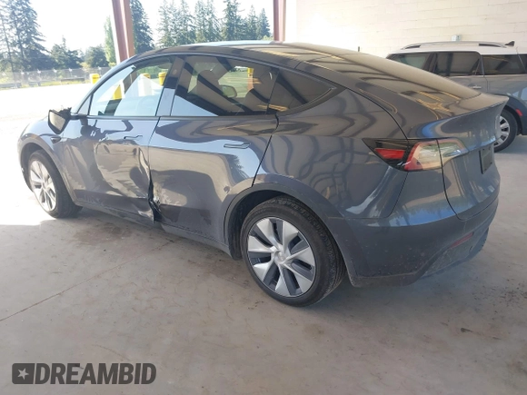 2023 Tesla Model Y Long Range with VIN 7SAYGAEE4PF906577, listed as a IAAI auction lot 42174987 with 13,260 mi miles and . Bid and sale history available at DreamBid. Image 3.