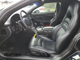 2002 Chevrolet Corvette with VIN 1G1YY32G325123703, listed as a Copart auction lot 77258804 with 26,325 mi miles and Salvage Title. Bid and sale history available at carsss.com. Image 7.