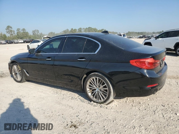 2018 BMW 5 Series 530i with VIN WBAJA5C54JG899845, listed as a Copart auction lot 76386124 with 57,379 mi miles and Salvage Title. Bid and sale history available at DreamBid. Image 2.