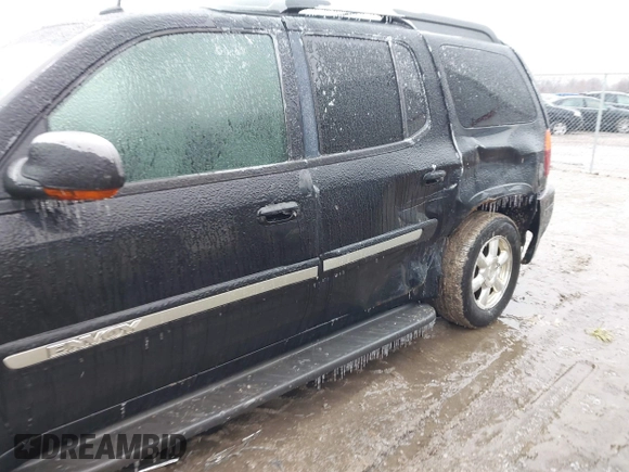 2005 GMC Envoy XL SLE with VIN 1GKET16S156160473, listed as a IAAI auction lot 41510661 with 233,942 mi miles. Bid and sale history available at carsss.com. Image 6.
