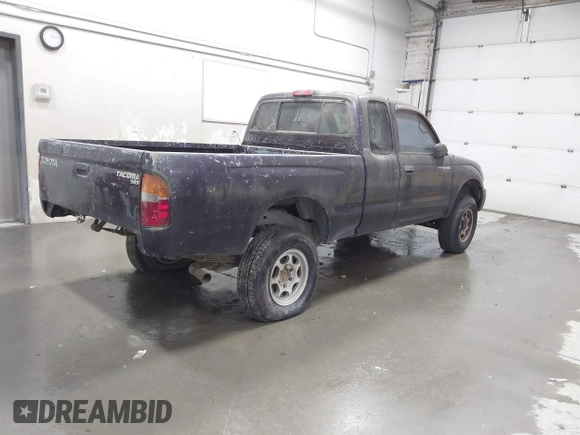 1999 Toyota Tacoma with VIN 4TAWM72N5XZ433296, listed as a IAAI auction lot 42595432 with 233,075 mi miles and . Bid and sale history available at DreamBid. Image 4.