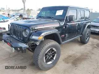 2020 Jeep Wrangler Unlimited Rubicon with VIN 1C4HJXFG1LW141335, listed as a IAAI auction lot 42724973 with 59,843 mi miles and . Bid and sale history available at DreamBid. Image 19.