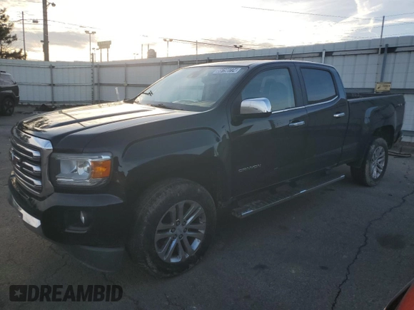 2015 GMC Canyon 4WD SLT z VIN 1GTG6CE34F1121540, wystawiony jako Copart lot #86190774 z przebiegiem 141 381 mil mil oraz Czysty tytuł • Clean title. Historia ofert i sprzedaży dostępna na DreamBid. Obrazek 1.