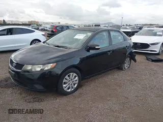 2010 Kia Forte EX with VIN KNAFU4A28A5050734, listed as a IAAI auction lot 42063165 with 179,284 mi miles. Bid and sale history available at carsss.com. Image 2.