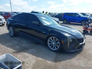 2025 Cadillac CT5 Sport with VIN 1G6DP5RK3S0100470, listed as a IAAI auction lot 42386329 with 6,143 mi miles and . Bid and sale history available at DreamBid. Image 1.