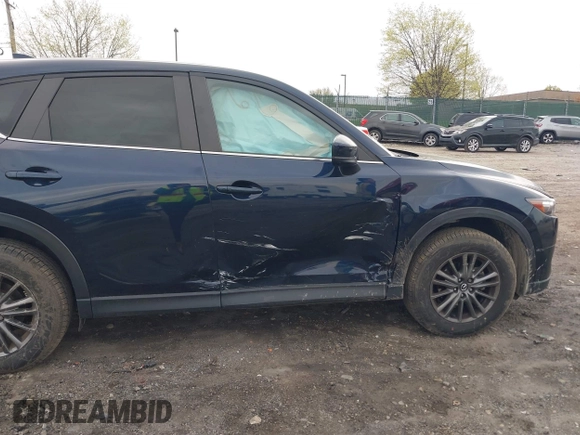 2021 Mazda CX-5 Touring with VIN JM3KFBCM1M1336457, listed as a IAAI auction lot 42034330 with 39,910 mi miles. Bid and sale history available at carsss.com. Image 6.