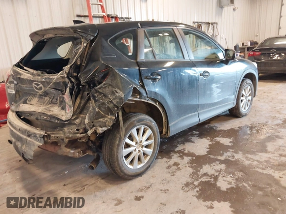 2015 Mazda CX-5 Sport with VIN JM3KE4BY0F0542655, listed as a IAAI auction lot 41471568 with 165,386 mi miles. Bid and sale history available at carsss.com. Image 4.